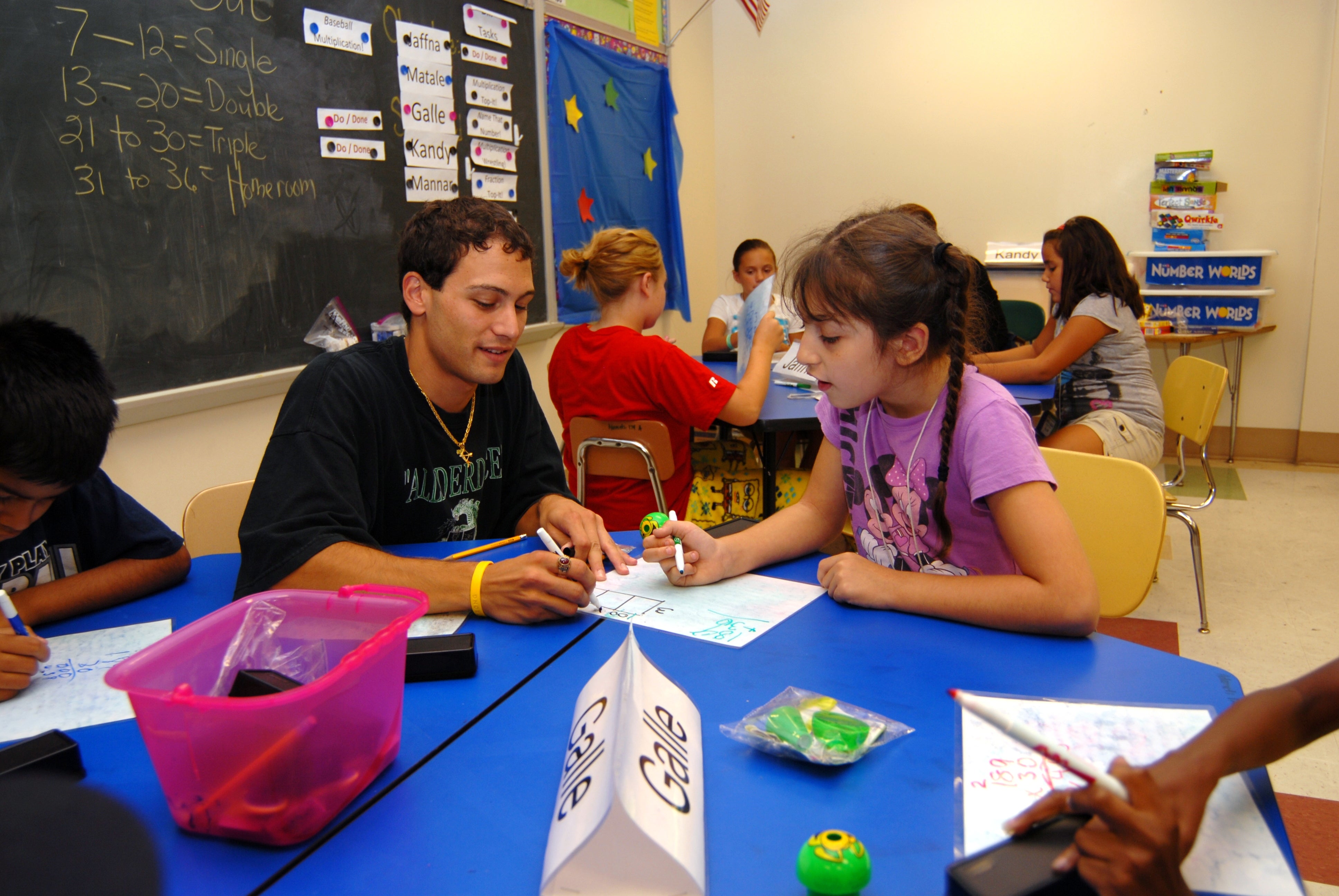 Children are helped with their math during an afterschool program.