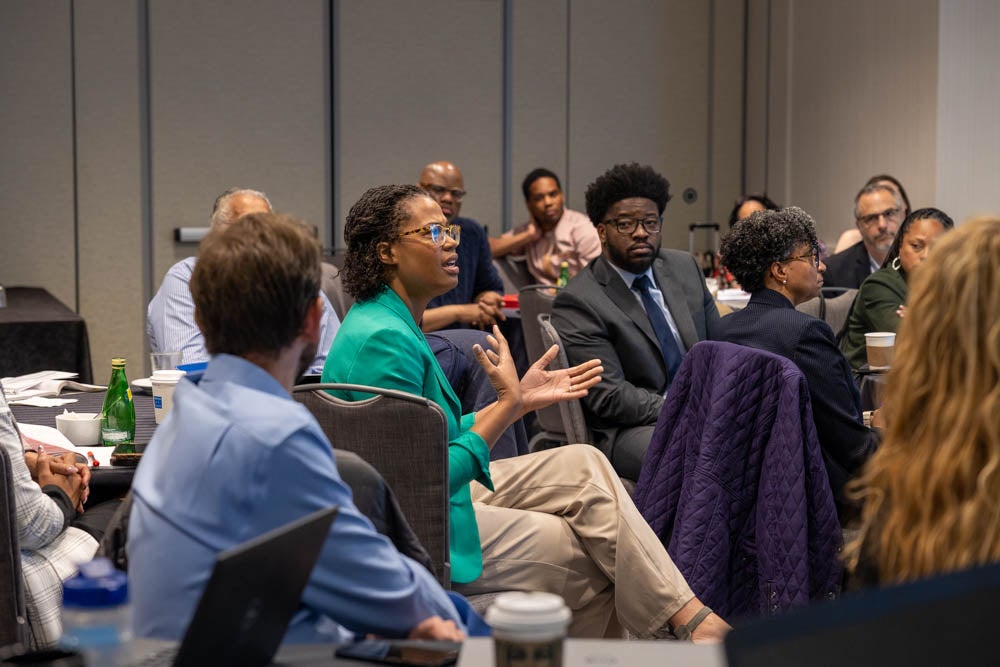 Education leaders in discussion at a conference.