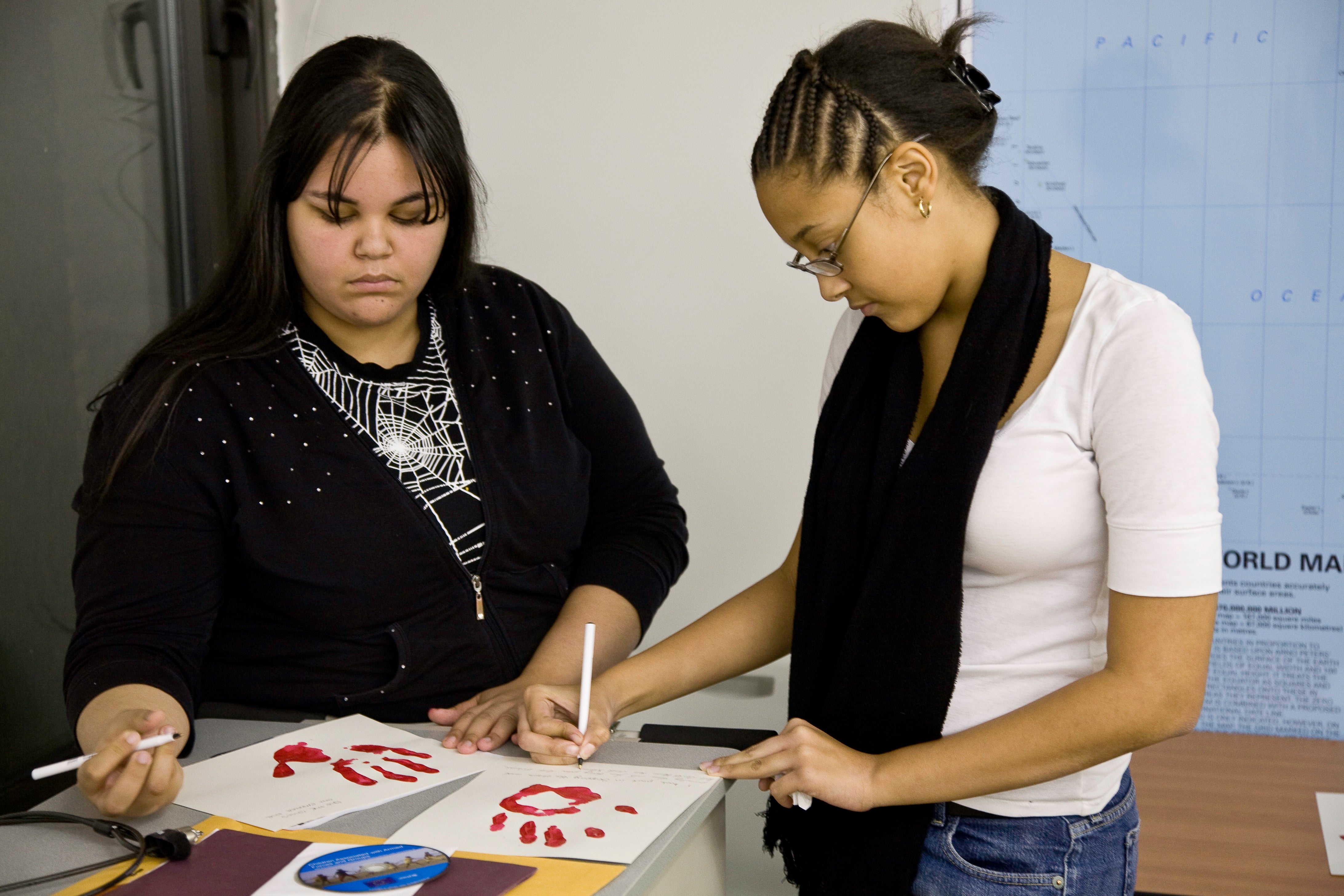 High school students work on an art project together.