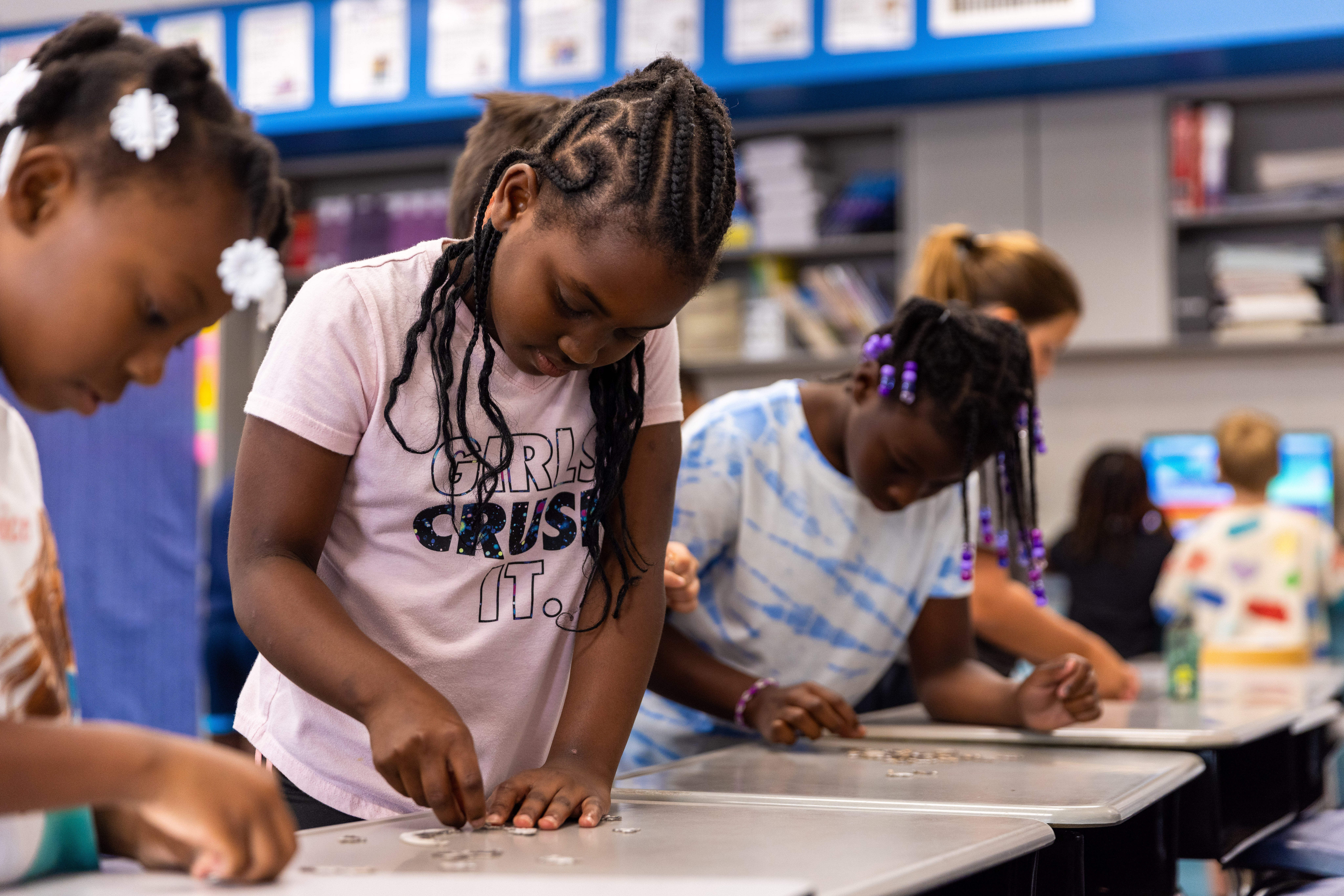 Children work on a crafts project during a summer program.
