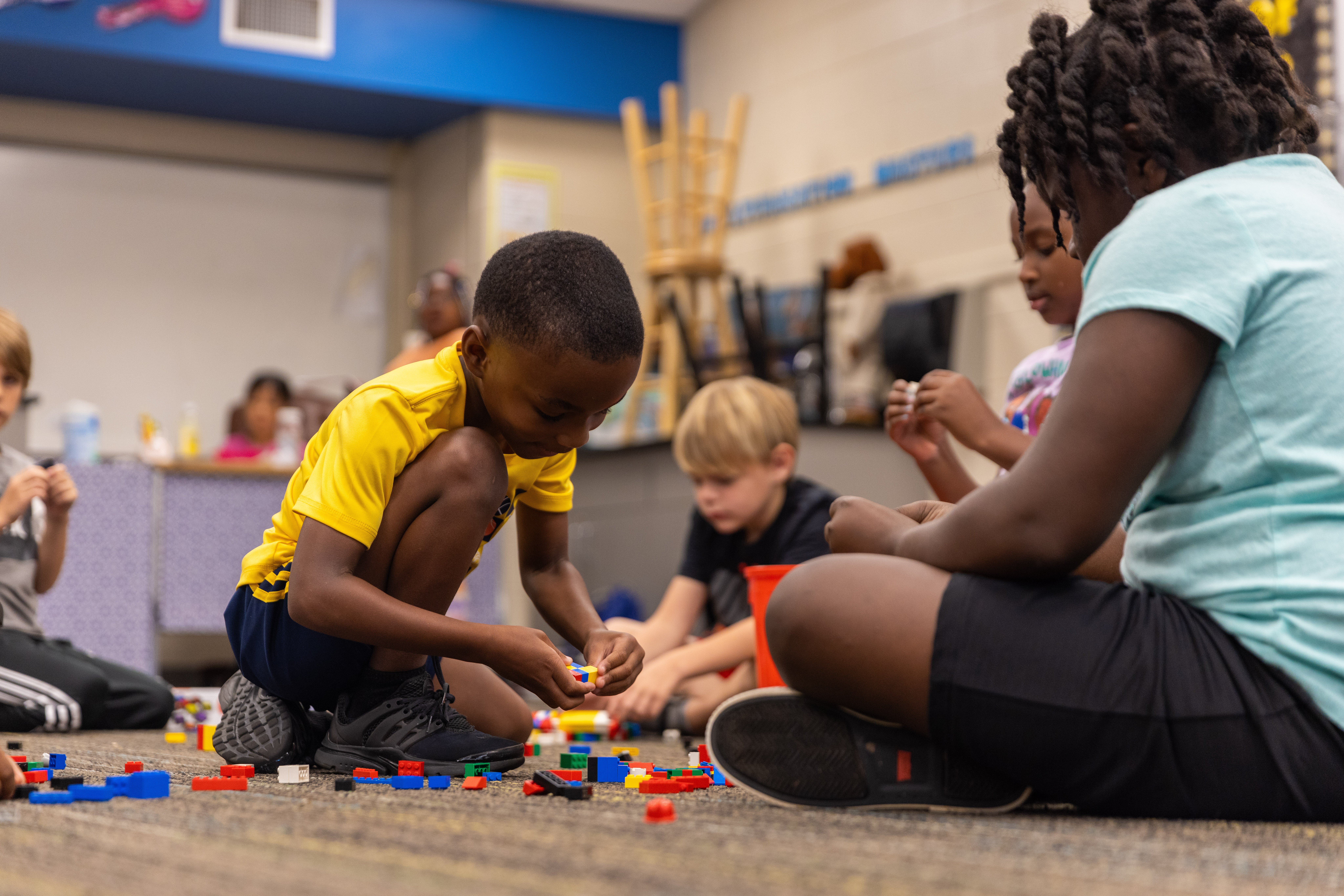 Children play with blocks during a summer program.