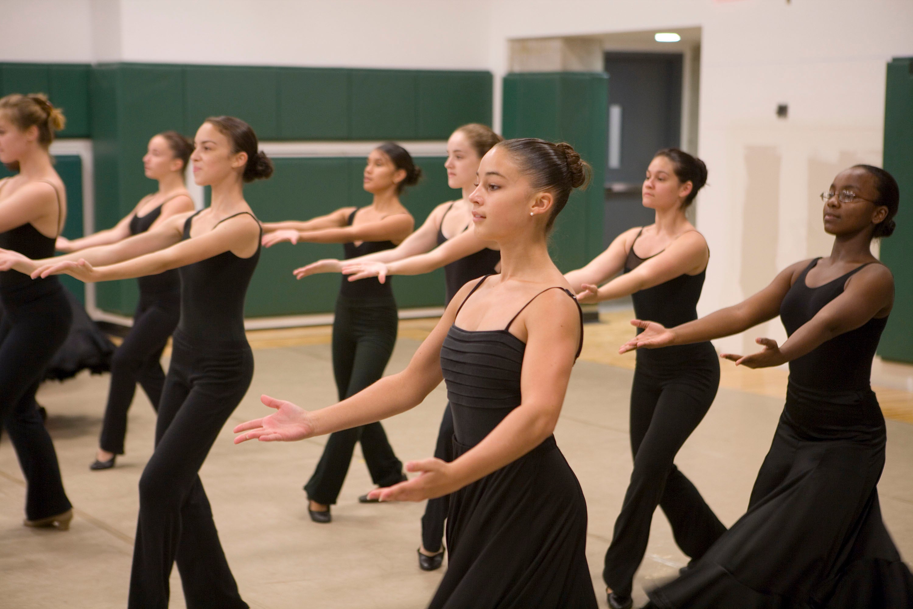 Young dancers in black during practice.