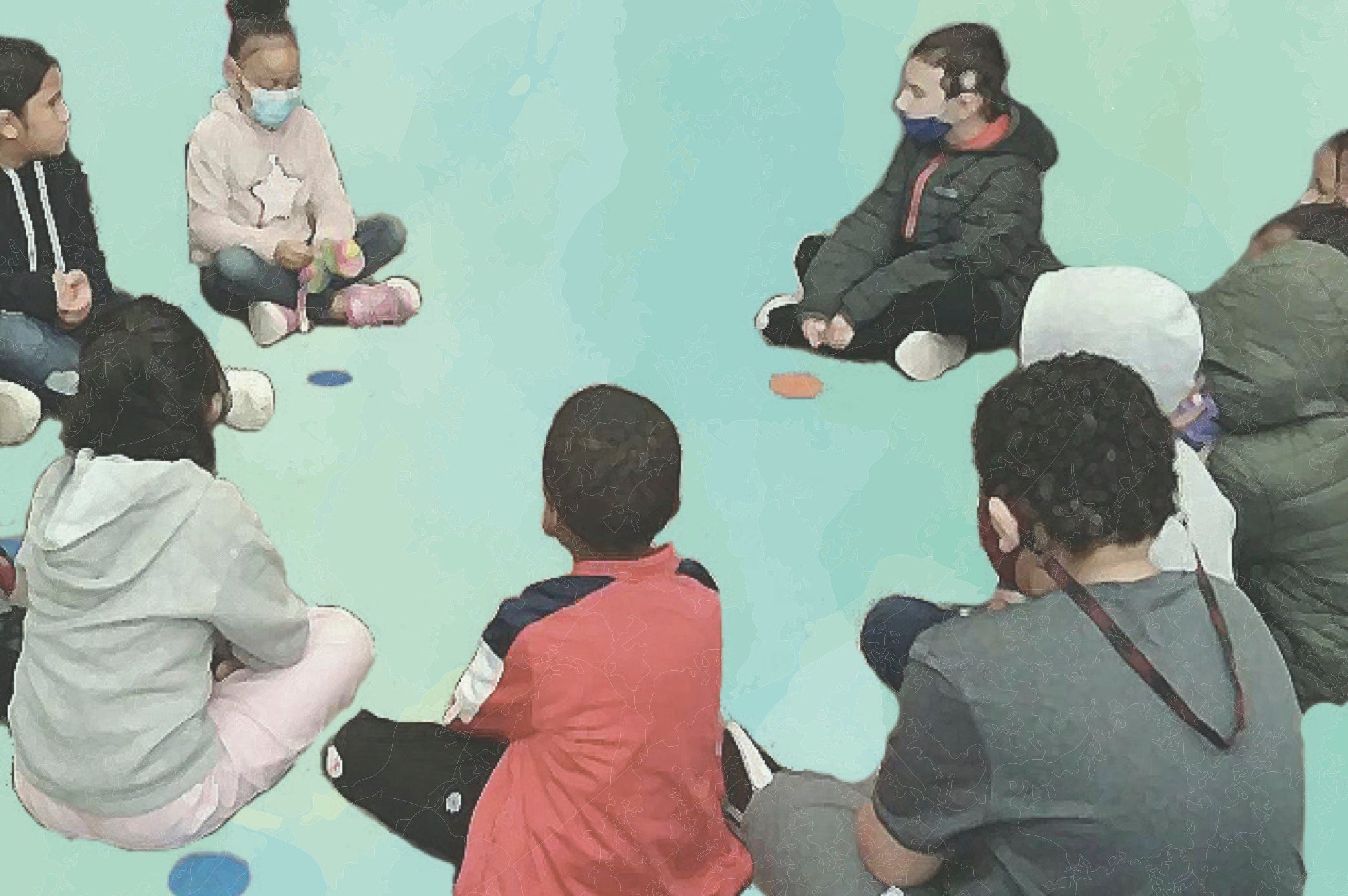 Students sit in a circle.