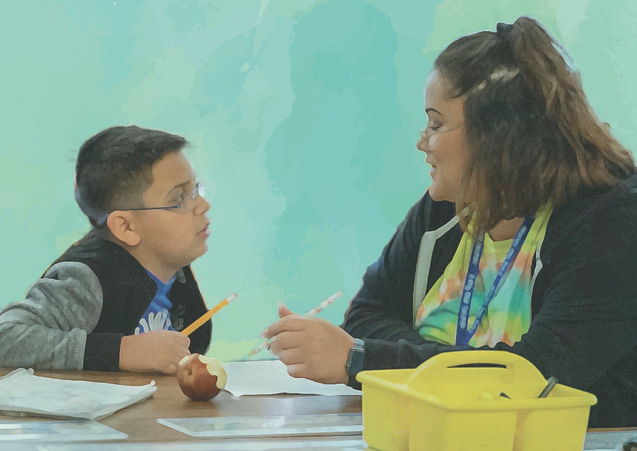 A student talks with his teacher.