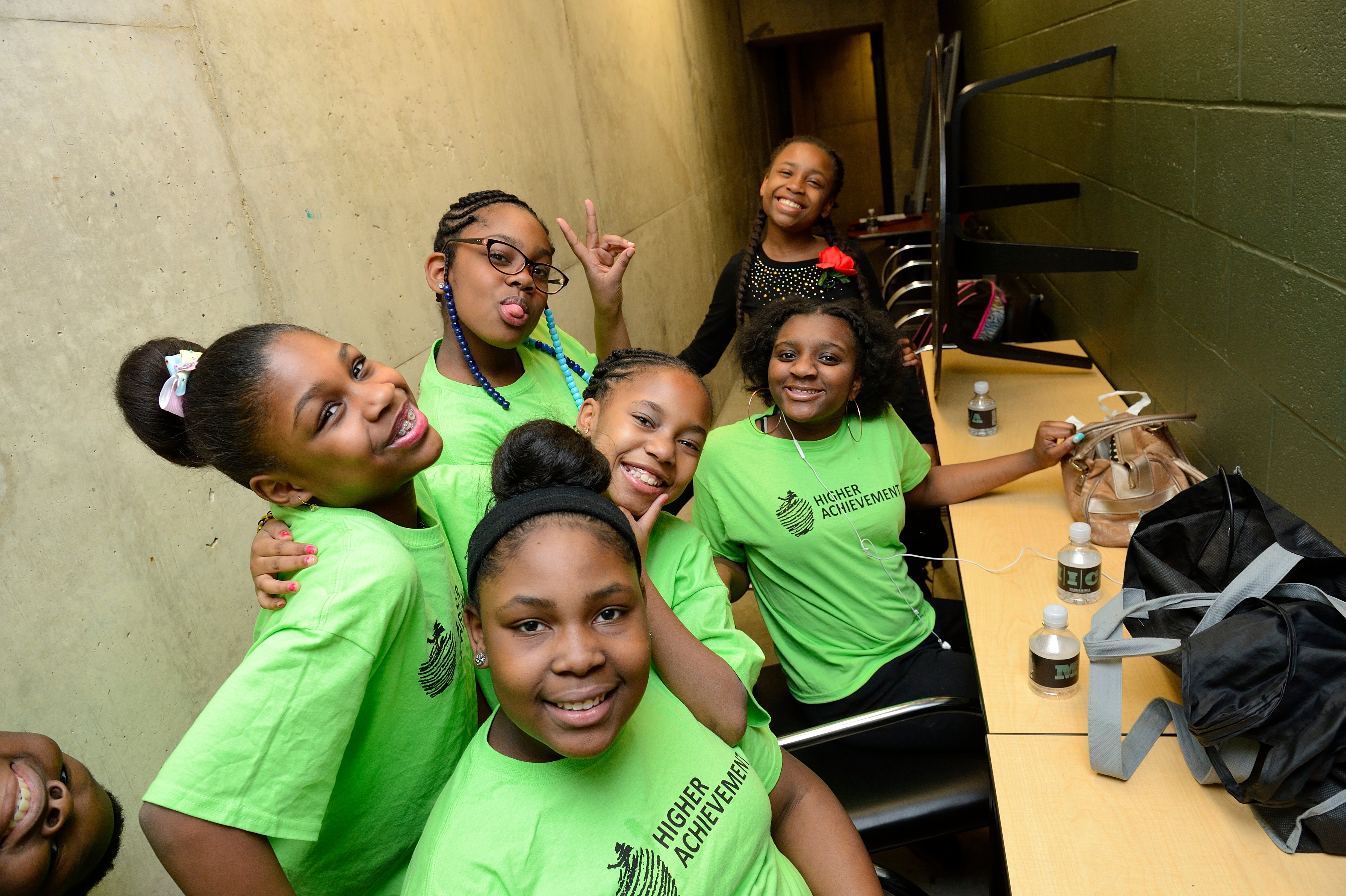 Baltimore middle-schoolers backstage at a performance of poetry written by Higher Achievement students.