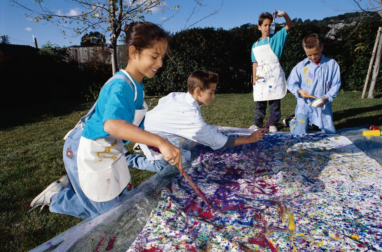 children painting on canvas