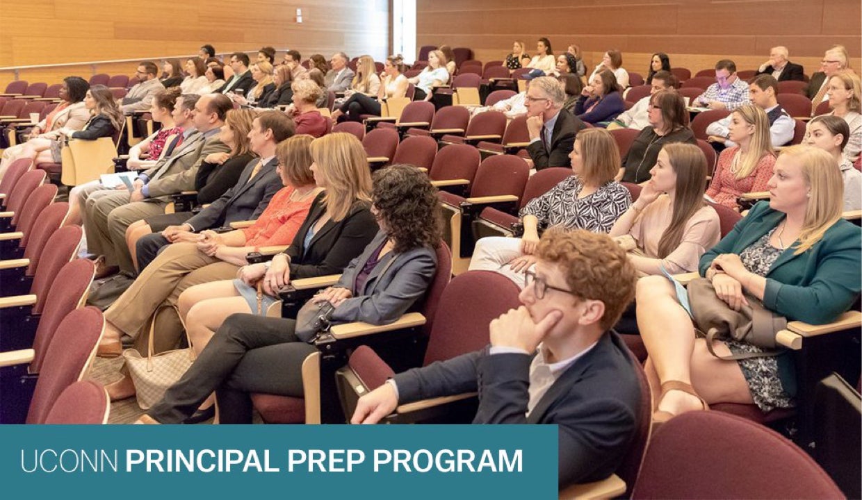 Audience members at a education conference on principal prep programs.