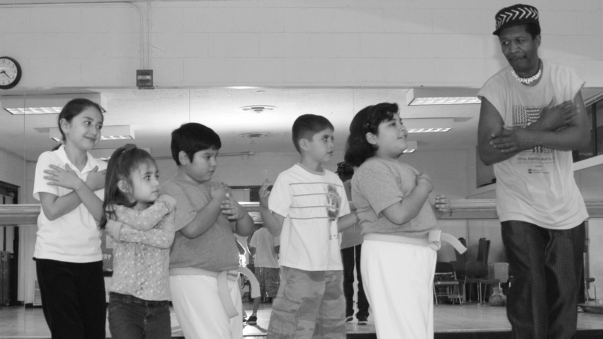 Musician-teacher Leo Hassan introduces his students to new dance steps.