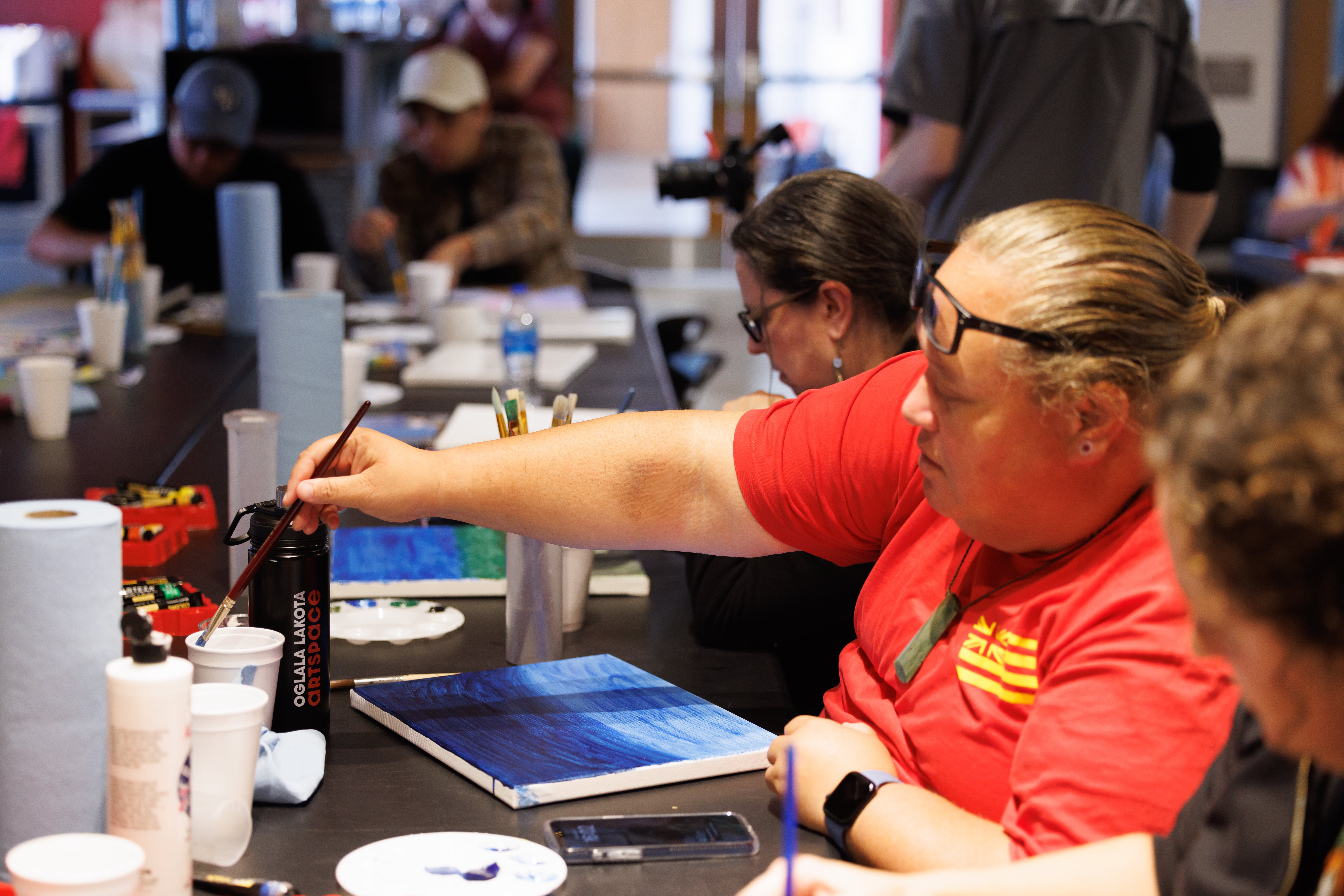 Person at a table painting