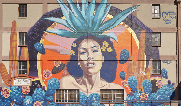 Image of a woman in a mural on the side of a building